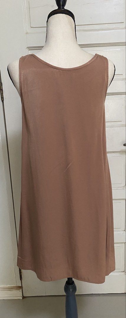 Bou Jeloud Sleeveless Dress (Category: Dresses) located in Muntinlupa City. Submitted by greatfindstore (Listing ID 1426595896, Image 2). Description: Sleeveless dress from Bou Jeloud. It features a scoop neckline and a straight silhouette. The dress is a solid, neutral color. The dress is a midi length..