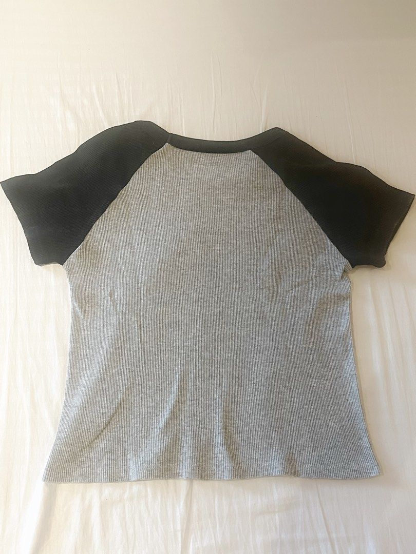 Brandy Melville Grey and Black Baseball Tee (Category: Shirts) located in Manila. Submitted by cammys.bin (Listing ID 1426696029, Image 3). Description: Bought a few years back from Brandy in San Francisco, but since I don’t wear it as much, I have decided to sell it🤍 Shipping paid by buyer.