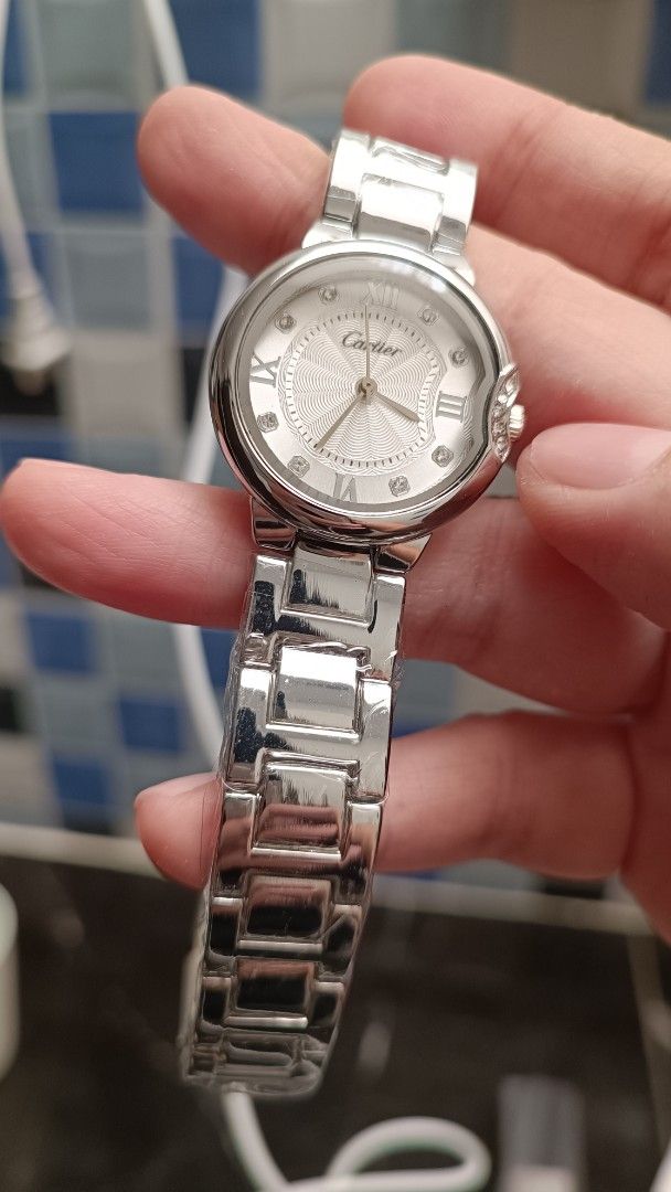 Cartier Stainless Steel Watch (Category: Luxury Watches) located in Cavite. Submitted by premfinds (Listing ID 1426682061, Image 2). Description: Elegant Cartier watch with a silver dial and stainless steel bracelet. Features Roman numeral hour markers and diamond accents. The watch has a round face and a secure clasp. A stylish accessory for everyday wear or special occasions. Japan movement O E M only for the price of 1850 but superb in quality