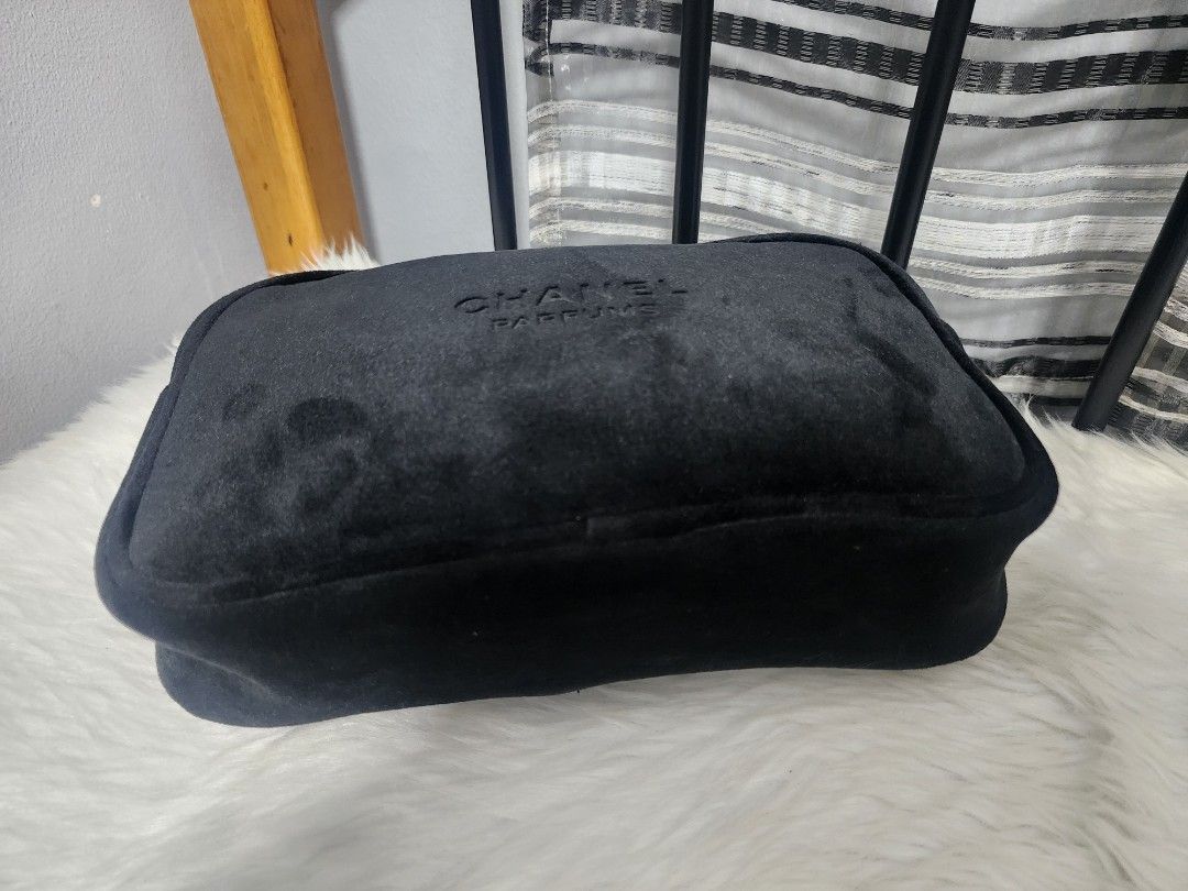 Chanel Parfums Black Cosmetic Pouch (Category: Luxury Bags & Wallets) located in Paranaque City. Submitted by rizasauthenticitems (Listing ID 1426592072, Image 2). Description: Black cosmetic pouch from Chanel Parfums. It features a zippered closure with a gold-tone zipper. The pouch is made of a soft, velvety material and has the Chanel Parfums logo embossed on the front. It's a stylish and practical accessory for storing cosmetics or other smal