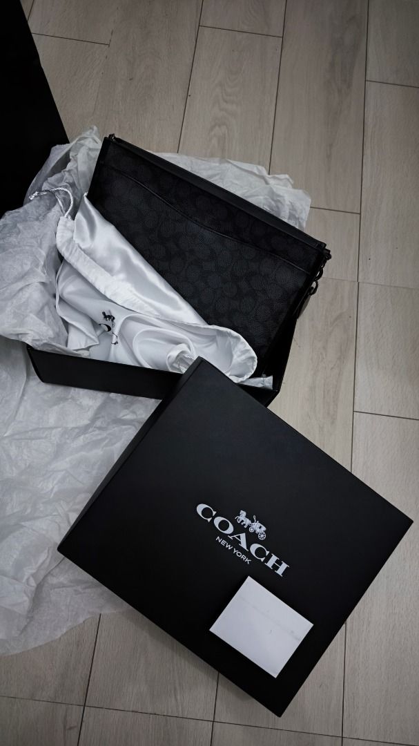Coach Charter Pouch (Category: Luxury Bags & Wallets) located in Manila. Submitted by mikko54321 (Listing ID 1426717888, Image 3). Description: Model: CBG27 CHR CHARTER POUCH, CHR, OS GRD08D72025 Never been used. Brandew. Price is negotiable. Just send me your offer. Authentic Coach Charter Pouch in black signature pattern. Comes with original box, dust bag, and paper bag. Features a zip closure and interior card slots. Includes a wrist strap. Pe
