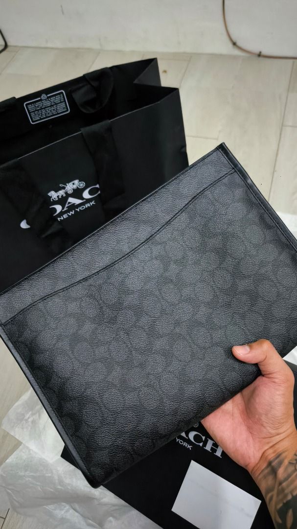 Coach Charter Pouch (Category: Luxury Bags & Wallets) located in Manila. Submitted by mikko54321 (Listing ID 1426717888, Image 1). Description: Model: CBG27 CHR CHARTER POUCH, CHR, OS GRD08D72025 Never been used. Brandew. Price is negotiable. Just send me your offer. Authentic Coach Charter Pouch in black signature pattern. Comes with original box, dust bag, and paper bag. Features a zip closure and interior card slots. Includes a wrist strap. Pe
