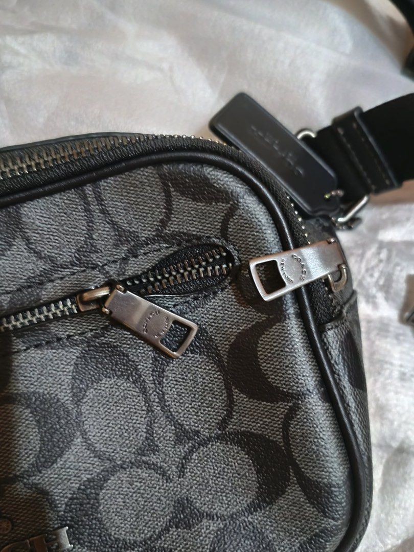 Coach Elias Belt Bag Sig (Category: Belt bags, Clutches and Pouches) located in Muntinlupa City. Submitted by gepdeg (Listing ID 1426671503, Image 2). Description: Coach Elias belt bag features a signature pattern and includes a detachable coin purse. The bag has a zip closure and an adjustable strap with a buckle. The bag has a tag with the model number CJ506 and the color is QB/Charcoal. The comparable value is $350 USD and $430 CAD..