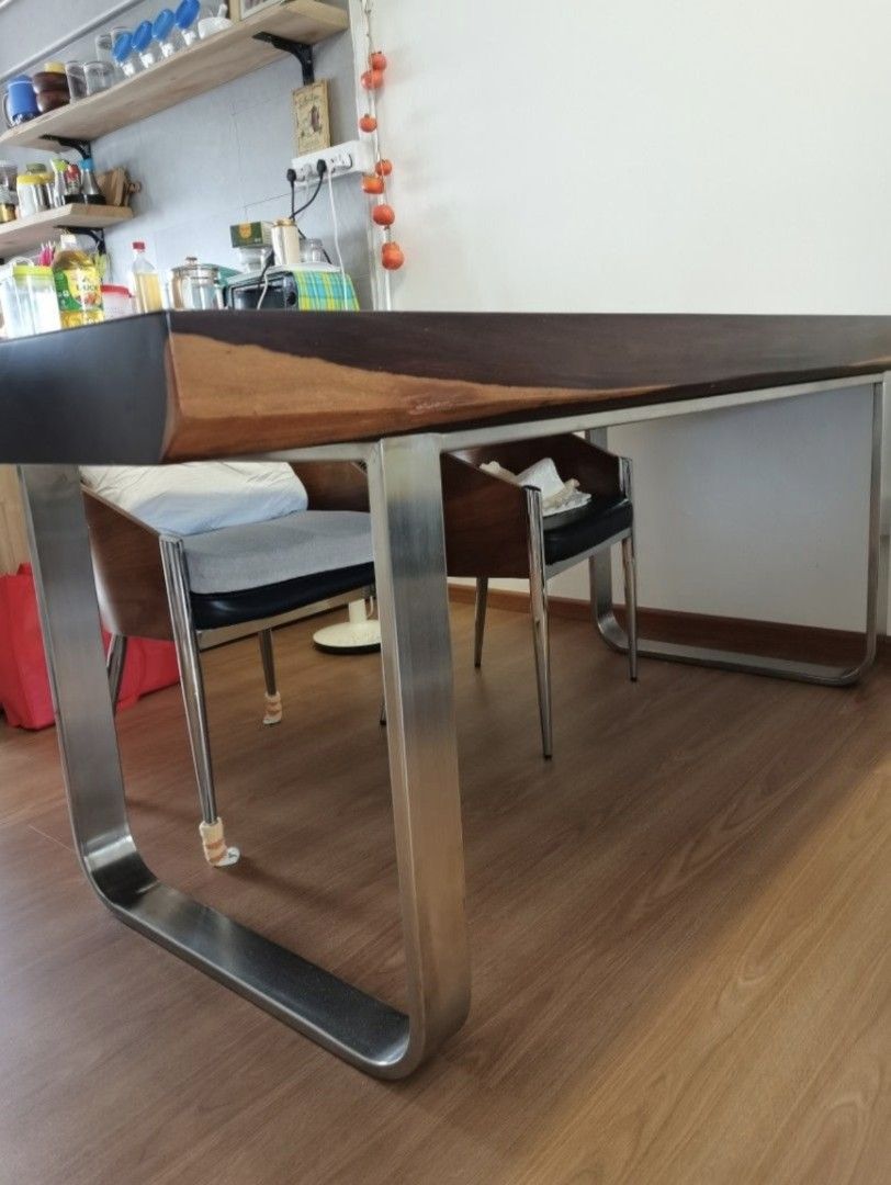 Dining table (Category: Tables & Sets) located in Singapore. Submitted by sago (Listing ID 1426709446, Image 2). Description: Beautiful solid wood dining table. Full 'eyelet' of the trunk can be seen. Custom made stainless steel legs ensure it fits most modern decor and easy to maintain too. Measures L187 x B78.5 cm. Thickness is 10cm. Arrange own transport..