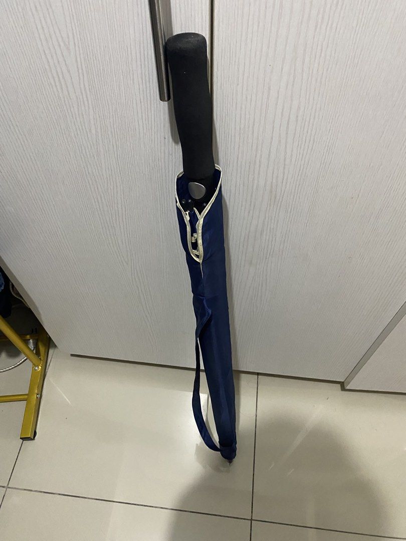 Disini Law Umbrella (Category: Umbrellas) located in Makati City. Submitted by dn8967 (Listing ID 1426692099, Image 2). Description: Navy blue umbrella with the "Disini Law" logo. It has a black handle and a matching navy blue carrying case. It is a standard size and suitable for everyday use. The umbrella is designed to provide protection from rain and sun..