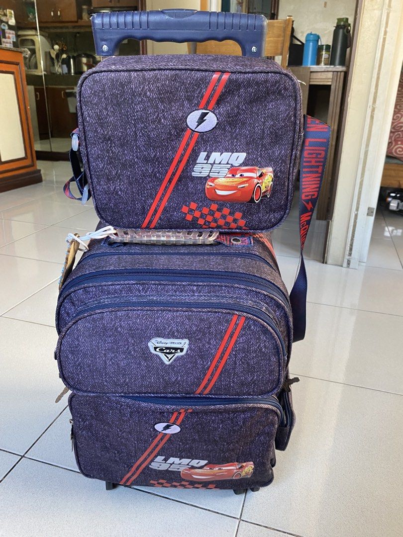 Disney Cars Rolling Backpack (Category: Strollers) located in Quezon City. Submitted by babyshark0203 (Listing ID 1426791101, Image 1). Description: Pre-loved Disney Cars Lightning McQueen rolling school bag in good condition. Perfect for preschool or grade school kids who have heavy books. Features: • Rolling wheels + pull handle (trolley style) • Multiple compartments for books, lunchbox, and supplies • Durable material and sturdy zippers • Fun