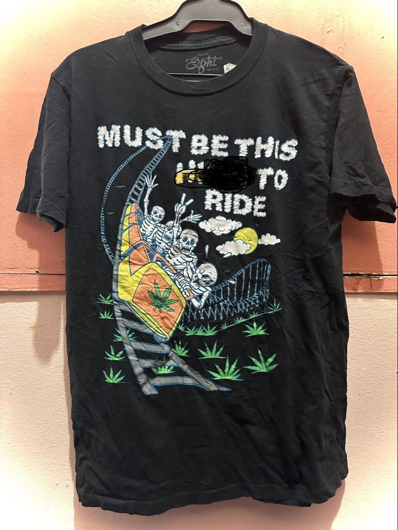 Eighty Eight Brand Graphic Tee Medium (Category: Tshirts & Polo Shirts ) located in Manila. Submitted by juanabanana (Listing ID 1426741688, Image 1). Description: Black graphic tee from Eighty Eight Brand. Features a roller coaster design with skeletons and the text "MUST BE THIS HIGH TO RIDE". Made in Mexico. Size is Medium. The shirt is made of 100% cotton. Measurements are approximately 20x27 inches. Tinakpan lang for community standards Need