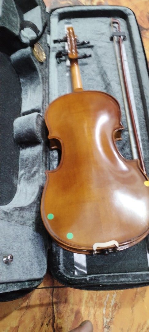 Gabriel Anne 2012 Violin with Case (Category: Musical Instruments) located in Caloocan City. Submitted by rowely_jpn (Listing ID 1426603616, Image 2). Description: Violin comes with a case and bow. The violin is a Gabriel Anne model, dated 2012. The violin has a brown finish. The case is black and has a handle. The bow is included and stored in the case..