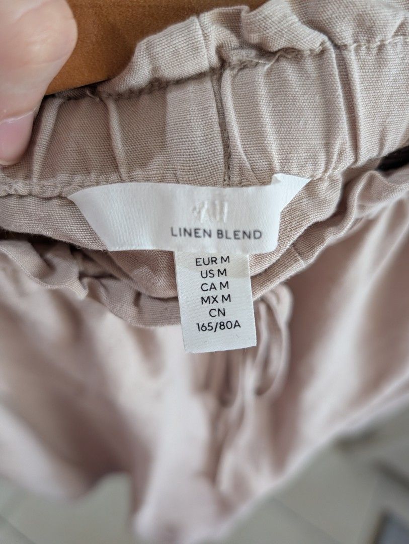 H&M Linen Blend Shorts - Size M (Category: Shorts) located in Manila. Submitted by cart_rd (Listing ID 1426591234, Image 3). Description: These H&M shorts are made from a linen blend. They feature an elastic waistband with a drawstring, front pockets, and two back pockets. The shorts are a neutral beige color. very good condition .