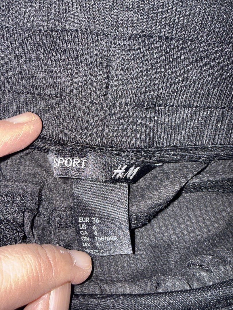 H&M Sport Pants - Size 6 (Category: Other Bottoms) located in Muntinlupa City. Submitted by secondchancechic (Listing ID 1426646294, Image 3). Description: Black H&M Sport pants with drawstring. Features a ribbed waistband and a textured fabric. Size US 6, EUR 36, and CN 165/68A. The pants have a relaxed fit with gathered details at the sides. Perfect for casual wear or light activities..
