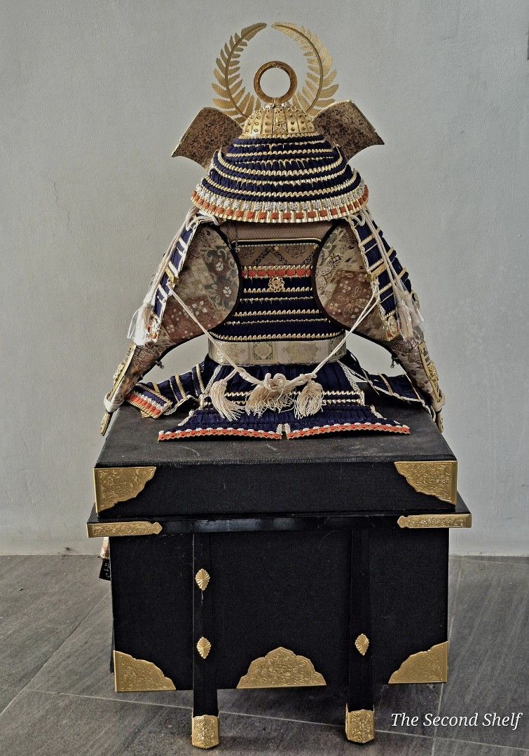 Japanese Samurai Armor Display with wooden box (Category: Vintage Collectibles) located in Santa Rosa. Submitted by thesecondshelf (Listing ID 1426690495, Image 3). Description: Exquisite Japanese samurai armor display. Features intricate detailing with gold accents and a navy blue and gold color scheme. Includes a decorative stand. The armor has a detailed helmet with a golden crest and decorative tassels..