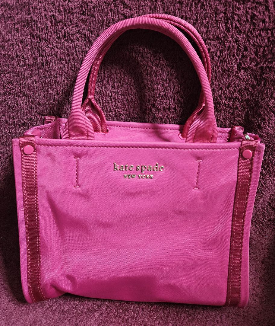 Kate Spade Sam Mini Tote (Category: Tote Bags) located in Makati City. Submitted by KuWeLaDevil01 (Listing ID 1426665617, Image 2). Description: All Authentic with original zippers and strap and tag. Vermillion in color and quality is very good, as this was only used twice. Some folds and light marks due to being in storage for a long time, but all in all, it is still a great tote. It has the main zippered compartment and two (2) pockets, the oth
