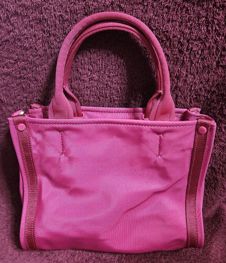 Kate Spade Sam Mini Tote (Category: Tote Bags) located in Makati City. Submitted by KuWeLaDevil01 (Listing ID 1426665617, Image 3). Description: All Authentic with original zippers and strap and tag. Vermillion in color and quality is very good, as this was only used twice. Some folds and light marks due to being in storage for a long time, but all in all, it is still a great tote. It has the main zippered compartment and two (2) pockets, the oth