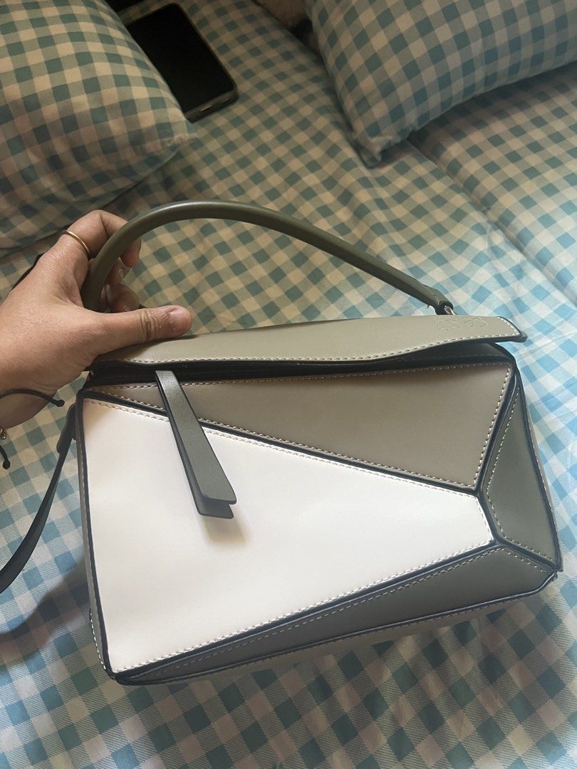 Loewe Puzzle Bag (Category: Luxury Bags & Wallets) located in Manila. Submitted by aujar12015 (Listing ID 1426675752, Image 1). Description: Preloved Loewe Mini Puzzle Bag Chic and stylish Mini Puzzle Bag with the iconic geometric design—perfect for elevating any outfit. Compact yet functional, great for daily use or casual outings. In preloved condition with normal signs of use. ⚠️ Authenticity not guaranteed. Please manage expectations before p