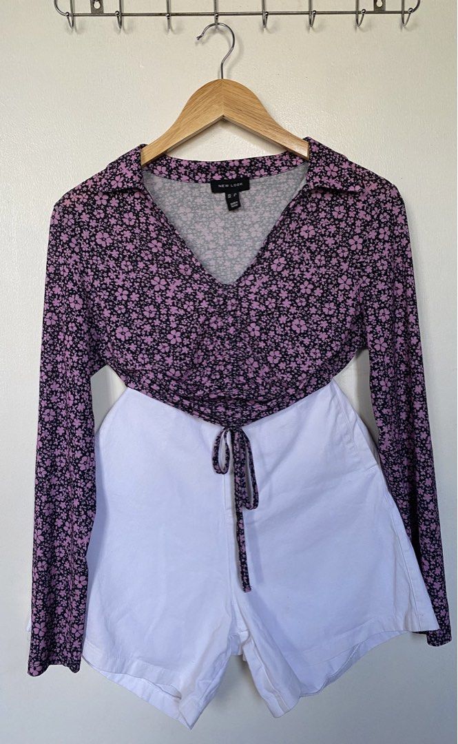 Longsleeve Top (Category: Blouses) located in Cavite. Submitted by jaydaascollection (Listing ID 1426594467, Image 1). Description: Floral top from New Look. Features a V-neckline and long sleeves. The top has a drawstring detail at the front. The size is UK 10. Made in Turkey. The top has a pink and black floral pattern..