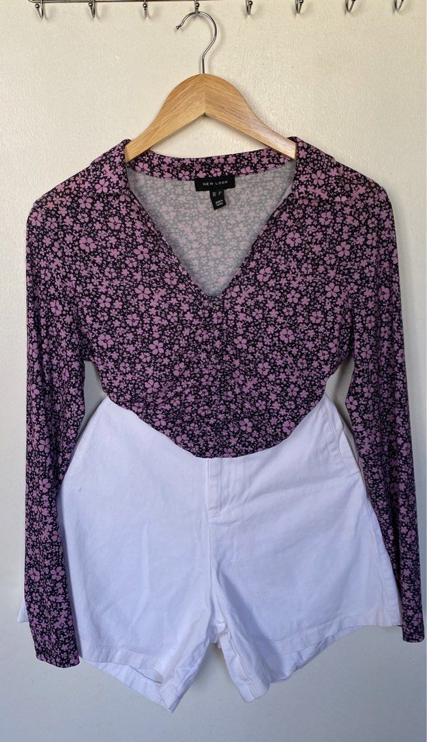 Longsleeve Top (Category: Blouses) located in Cavite. Submitted by jaydaascollection (Listing ID 1426594467, Image 2). Description: Floral top from New Look. Features a V-neckline and long sleeves. The top has a drawstring detail at the front. The size is UK 10. Made in Turkey. The top has a pink and black floral pattern..