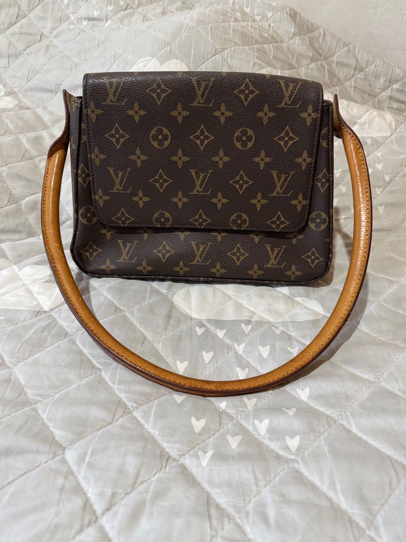 Louis Vuitton monogram Shoulder Bag (Category: Luxury Bags & Wallets) located in Danao, Cebu. Submitted by jojie.1983 (Listing ID 1426711086, Image 1). Description: - Louis Vuitton Looping Shoulder Bag - Features the signature monogram pattern - Shoulder bag design for easy carrying - Classic and timeless design - Interior with zipper pocket -excellent condition .