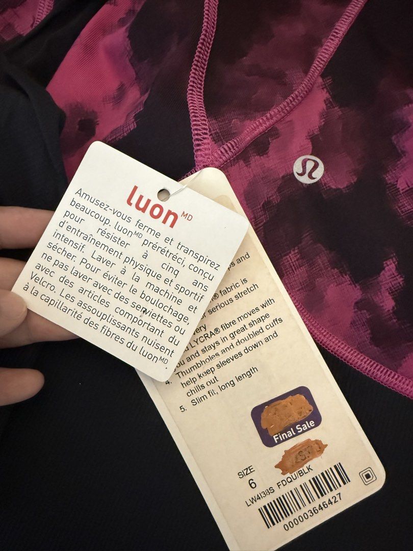 Lululemon Athletica Luon MD Jacket Size 6 (Category: Coats, Jackets and Outerwear) located in Muntinlupa City. Submitted by secondchancechic (Listing ID 1426654033, Image 3). Description: Lululemon Athletica jacket in size 6. Features a vibrant pink and black pattern with a full zip closure and hood. Made with Luon MD fabric. Includes thumbholes and double cuffs. The jacket has a slim fit and a long length. Designed in Vancouver and made in China