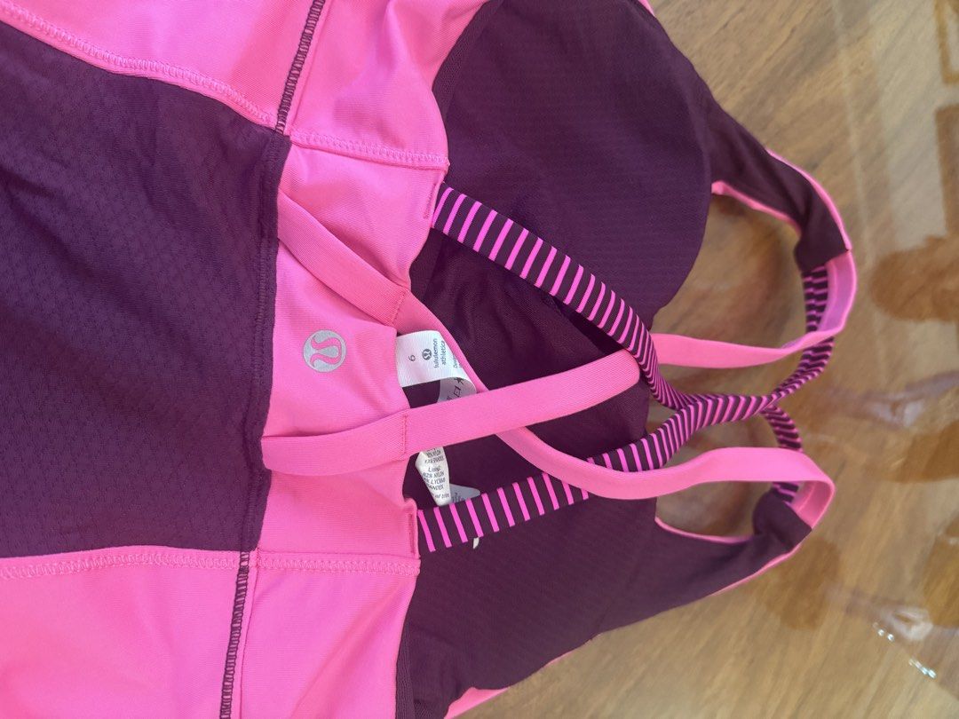 Lululemon Energy Tank - Size 6 (Category: Activewear) located in Muntinlupa City. Submitted by secondchancechic (Listing ID 1426653311, Image 3). Description: Lululemon Energy Tank in size 6. Features a pink and striped design. The tank top has a built-in bra with light support and medium coverage. Made with four-way stretch Power Luxtreme fabric. Includes breathable mesh panels. The tank top has reinforced straps for added support..