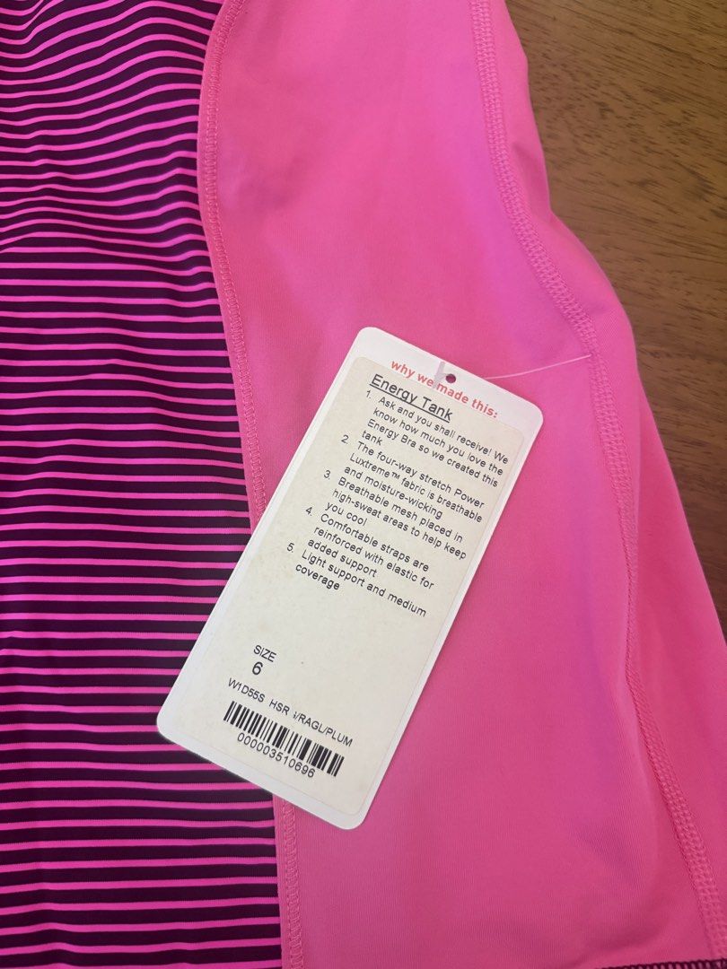 Lululemon Energy Tank - Size 6 (Category: Activewear) located in Muntinlupa City. Submitted by secondchancechic (Listing ID 1426653311, Image 2). Description: Lululemon Energy Tank in size 6. Features a pink and striped design. The tank top has a built-in bra with light support and medium coverage. Made with four-way stretch Power Luxtreme fabric. Includes breathable mesh panels. The tank top has reinforced straps for added support..