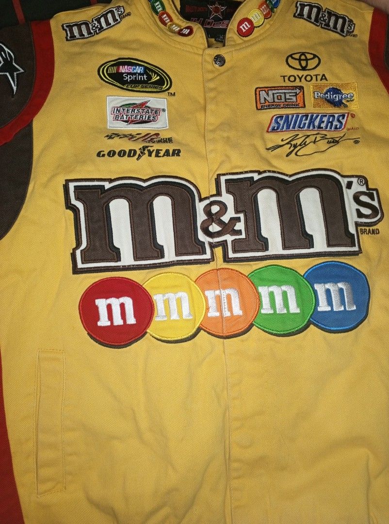 M&M's Kyle Busch NASCAR Jacket (Category: Coats, Jackets and Outerwear) located in Manila. Submitted by shainabngc85147 (Listing ID 1426669153, Image 2). Description: NASCAR RACING JACKET KYLE BUSCH LARGE SIZE FROM JAPAN 10/10 CONDI. SELLING FOR 15K 🛍️.