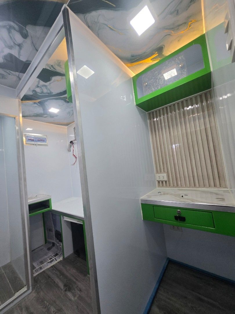 Mobile Clinic - Fully Equipped (Category: Commercial) located in Manila. Submitted by jonathanca24182 (Listing ID 1426790168, Image 2). Description: Mobile clinic with a modern interior design. Features include built-in cabinets, a sink, and ample lighting. The exterior is painted in white and green with "Mobile Clinic" branding. Includes a QR code for easy access. equipment : xray and dr ( subject for qoutation).