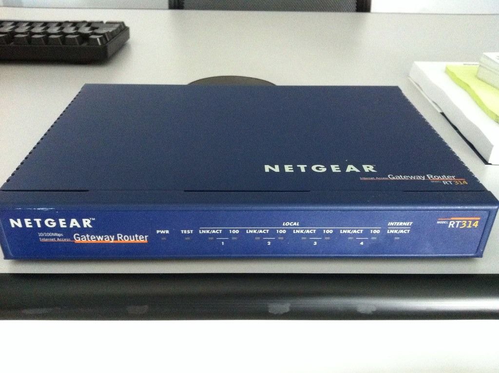 NETGEAR RT314 Gateway Router (Category: Networking) located in Pasig City. Submitted by v-lounge (Listing ID 1426638491, Image 2). Description: NETGEAR RT314 Gateway Router. Includes the power adapter 110 volt from USA solid steel construction old school for the purist or collector Has multiple LAN ports and an internet port. The front panel has indicator lights for power, test, link/act, and internet activity.