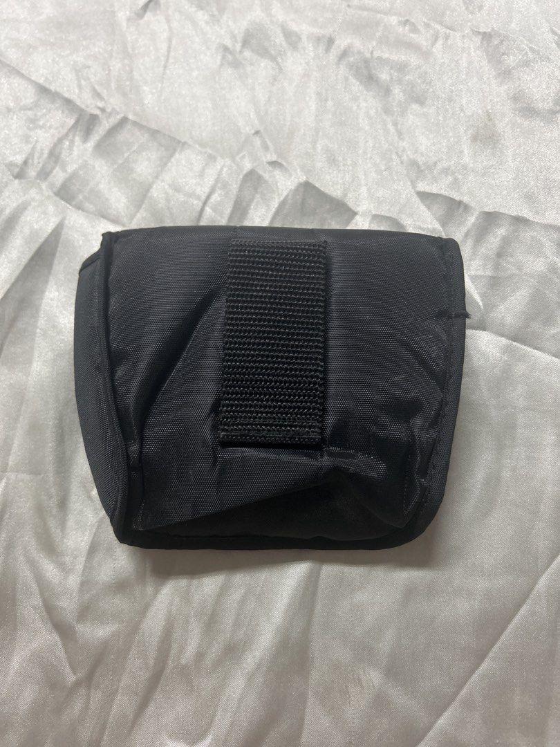 Olympus Camera Case/ for belt (Category: Camera Bags & Carriers) located in Bulacan. Submitted by ourdailybreads (Listing ID 1426667813, Image 2). Description: Black Olympus camera case. Features a flap closure with the Olympus logo. Includes a belt loop on the back for easy carrying. The interior is lined with a soft material to protect the camera..