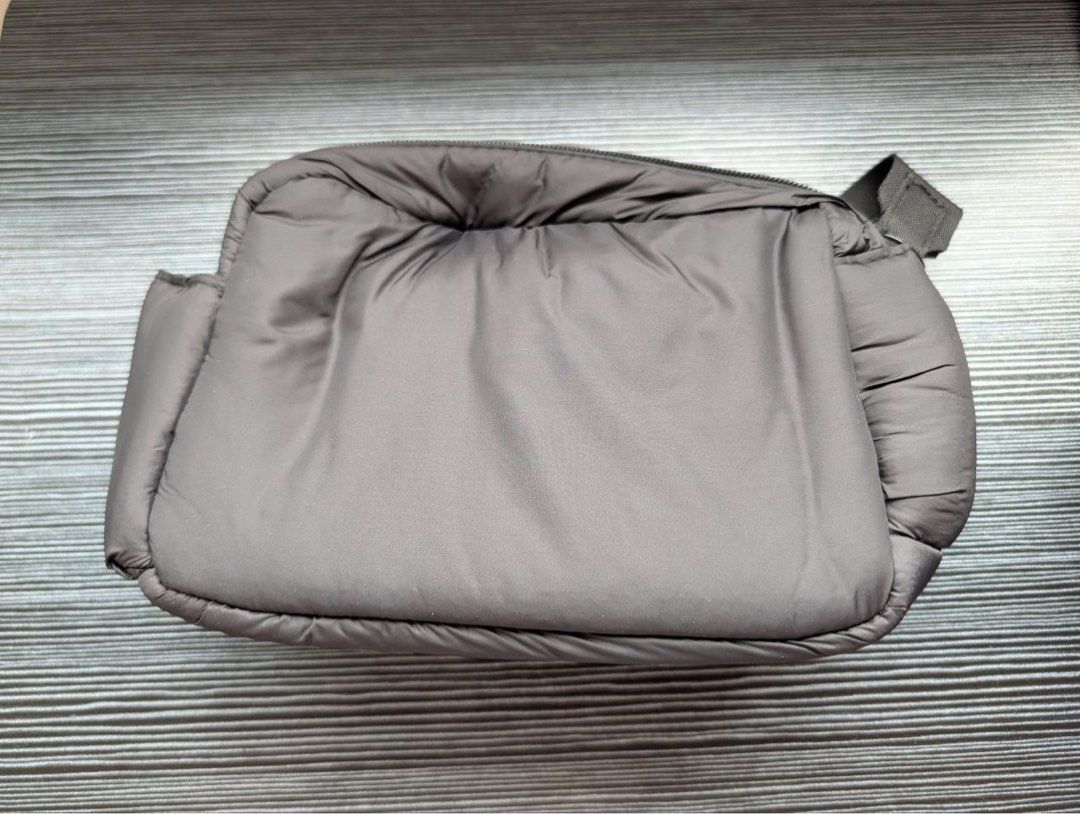 Sephora Puffer Cosmetic Toiletry Bag (Category: Makeup) located in Manila. Submitted by cavemandraws (Listing ID 1426674803, Image 2). Description: Sephora cosmetic bag is a stylish and practical accessory. It features a padded design and a zippered closure. The bag has a main compartment and a side pocket. It is perfect for storing makeup, skincare products, or other small essentials. The bag is compact and easy to carry..