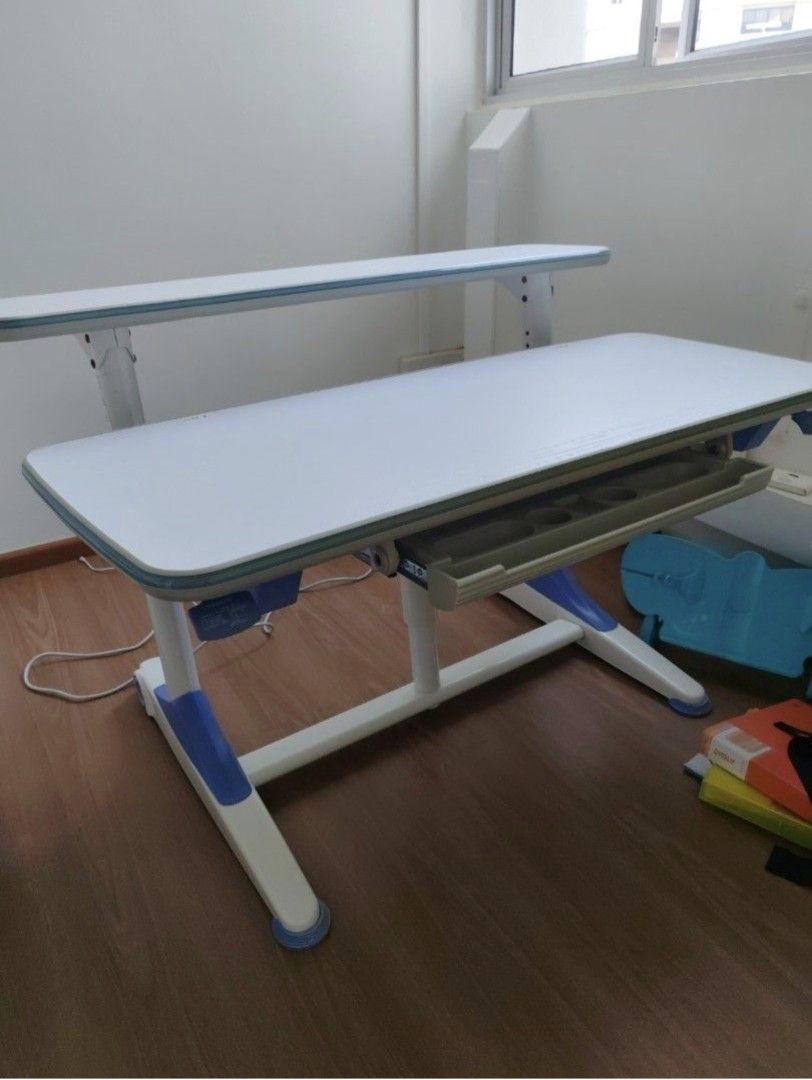 Study Table (Category: Other Home Furniture) located in Singapore. Submitted by sago (Listing ID 1426711438, Image 2). Description: Adjustable height from 52cm to 76cm. Width about 114 to 115cm. Paid over $800 for the table. Please arrange own transport. Collect at 460534..