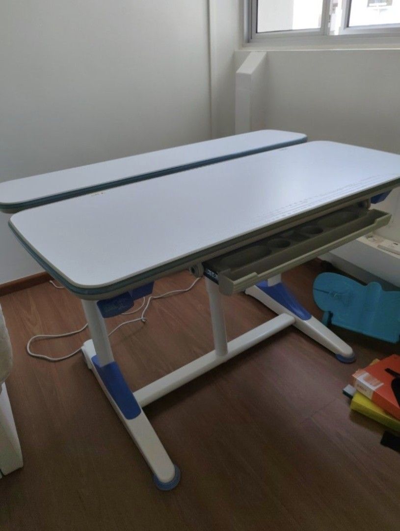 Study Table (Category: Other Home Furniture) located in Singapore. Submitted by sago (Listing ID 1426711438, Image 1). Description: Adjustable height from 52cm to 76cm. Width about 114 to 115cm. Paid over $800 for the table. Please arrange own transport. Collect at 460534..