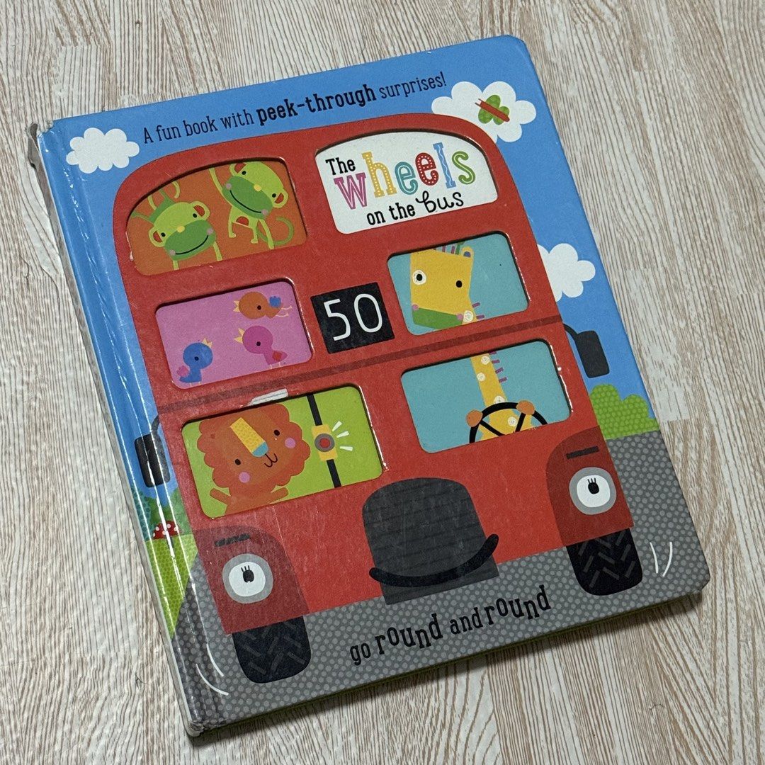 The Wheels on the Bus Peek-Through Book (Category: Children's Books) located in Marikina City. Submitted by lovegoeson (Listing ID 1426659590, Image 1). Description: - "The Wheels on the Bus" Peek-Through Book - Features a fun bus design - Includes peek-through surprises - Bright and colorful.