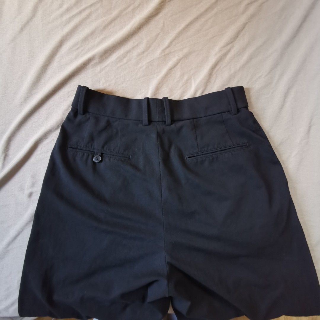 Uniqlo wide Pleated Pants (Category: Other Bottoms) located in Caloocan City. Submitted by jpcnslcn (Listing ID 1426786968, Image 2). Description: Black pleated pants from Uniqlo. Made in China. Size M, with a waist of 63-69cm and hips of 88-94cm. The material is 66% polyester and 28% rayon. Features a classic design with a straight leg cut. Perfect for a smart casual look..