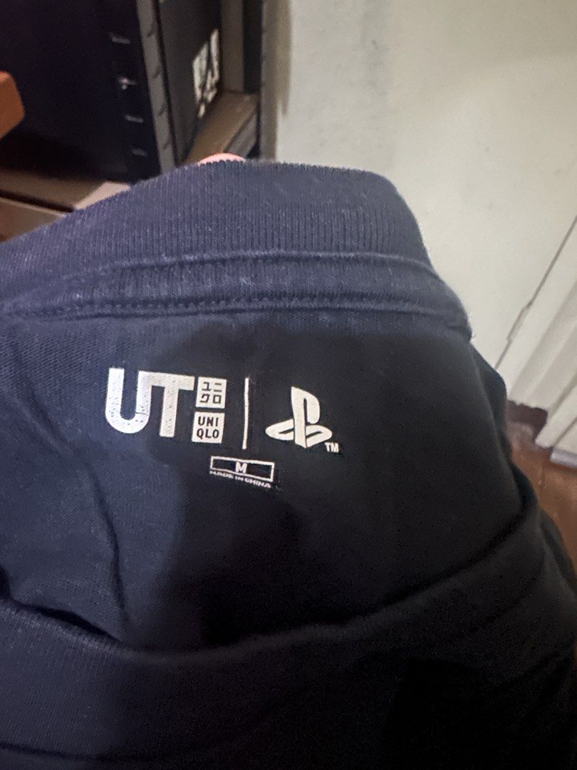 Uniqlo UT PlayStation Graphic Tee - M (Category: Tshirts & Polo Shirts ) located in Manila. Submitted by nuggs267 (Listing ID 1426764841, Image 3). Description: Uniqlo UT PlayStation Graphic Tee. Size M. Black color. Features PlayStation logo and console design. Condition: 9/10. Meetup at Greenbelt, Glorietta, and SM Mall of Asia. Slightly used Rfs: Decluttering.