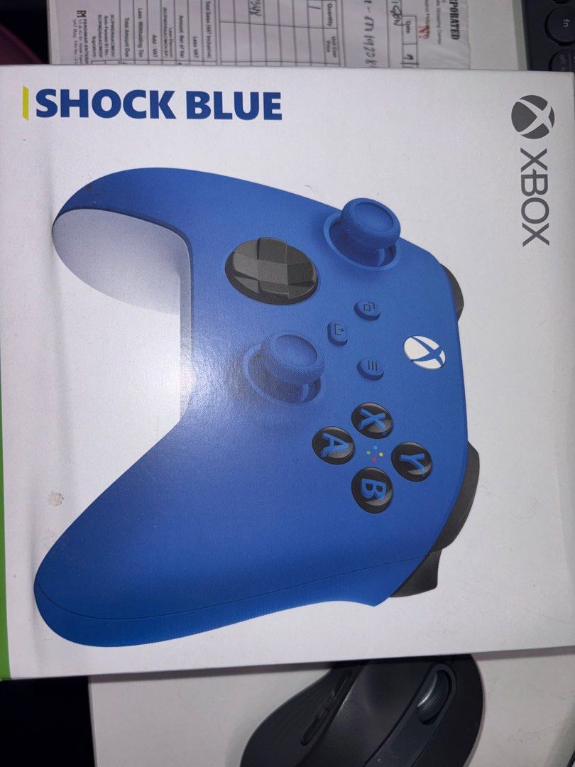 Xbox Wireless Controller - Shock Blue (Category: Controllers) located in Quezon City. Submitted by mticzon (Listing ID 1426738281, Image 3). Description: Xbox Wireless Controller in Shock Blue. Includes the original box and a sales invoice dated September 12, 2025.The controller is blue with white accents. RFS: Only used it once. No time to play..