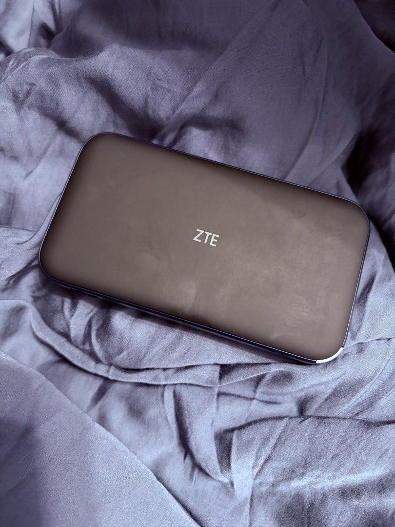 ZTE MU5002 5G Mobile WiFi Router (Unit only) (Category: Networking) located in Bulacan. Submitted by mowmew (Listing ID 1426651696, Image 2). Description: I’m selling my pre-loved ZTE MU5002 (unit only). This router has a LAN port, so it can be connected to your existing WiFi network. Here are the specifications of the ZTE MU5002: - It’s a 5G mobile WiFi router that supports both NSA and SA 5G technologies. - It also supports 5G NR and LTE EN-DC.