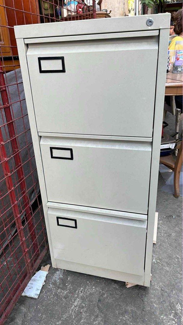 3-Drawer Metal Filing Cabinet (Category: Office Furniture & Fixtures) located in Manila. Submitted by santab01016652 (Listing ID 1426842044, Image 1). Description: Durable metal filing cabinet with three drawers. Features a neutral color and a lock for security. Each drawer has a label holder. Ideal for home or office use..