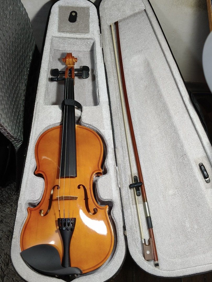 4/4 Violin with Complete Setup & Accessories (Category: Musical Instruments) located in Marikina City. Submitted by jamvg (Listing ID 1426892581, Image 1). Description: Full package includes: 4/4 Violin Horsehair bow Bridge mute Rosin block Cleaning cloth (from my glasses case) Chin rest Hard case (missing 1 zipper; other works perfectly) Barely used, since I have no time to practice. Willing to negotiate price ☺️.