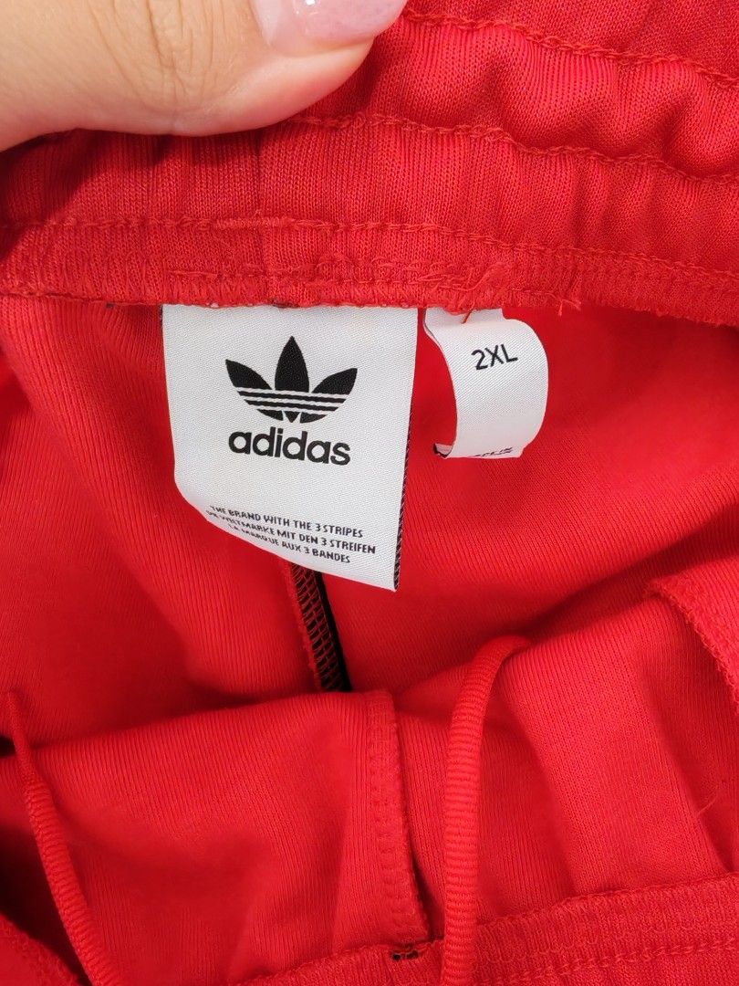 Adidas Red Track Pants 2XL (Category: Joggers) located in Baguio. Submitted by bag-a-holic.bygaile.ph.2.0 (Listing ID 1426796815, Image 3). Description: no flaws wline: 33-42.