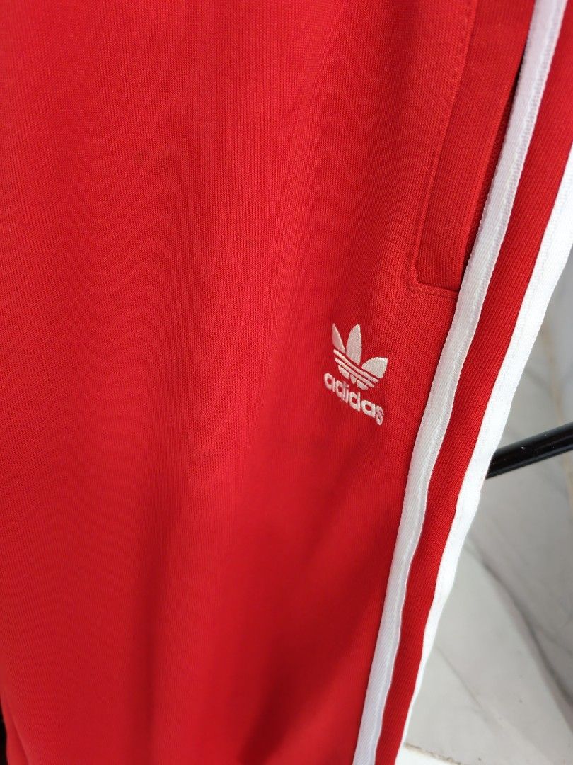 Adidas Red Track Pants 2XL (Category: Joggers) located in Baguio. Submitted by bag-a-holic.bygaile.ph.2.0 (Listing ID 1426796815, Image 2). Description: no flaws wline: 33-42.