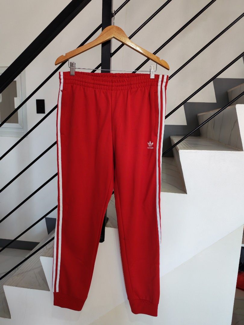 Adidas Red Track Pants 2XL (Category: Joggers) located in Baguio. Submitted by bag-a-holic.bygaile.ph.2.0 (Listing ID 1426796815, Image 1). Description: no flaws wline: 33-42.