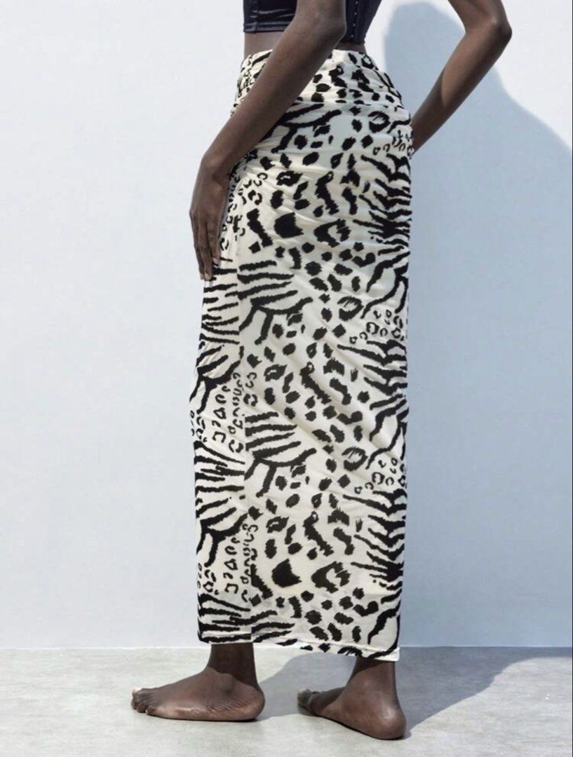 Animal Print Maxi Skirt (Category: Skirts) located in Pasig City. Submitted by kathB (Listing ID 1426897222, Image 2). Description: Eye-catching maxi skirt with a unique animal print design, featuring a high waist and flattering silhouette with ruched side detail. Perfect for a bold or laid-back look. Used only once. Fits Large to XL comfortably. :).