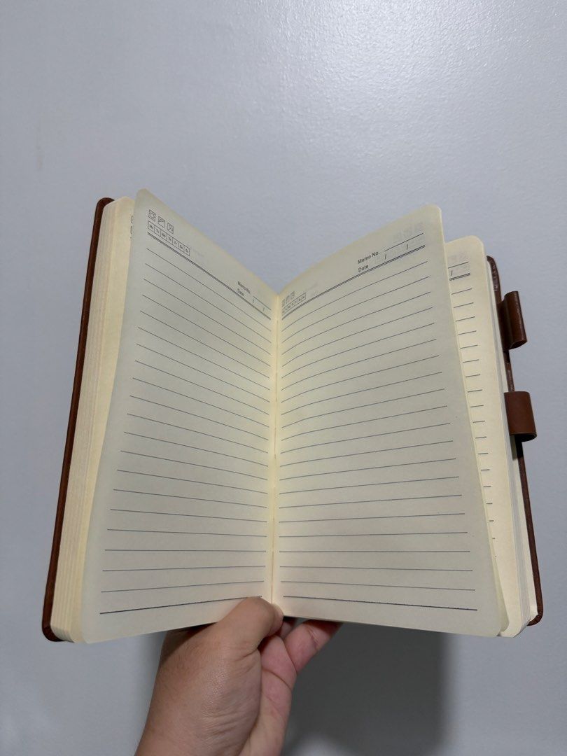 Brand New Brown Leather Notebook with Buckle (Category: Stationery & School Supplies) located in Quezon City. Submitted by shop_piascloset (Listing ID 1426824445, Image 3). Description: Brand new faux-leather notebook / journal – Rich tan/brown textured cover with debossed deer head logo – Gold-toned metal buckle closure for a secure and premium feel – Built-in pen loop on the side for convenience – Lined cream-colored pages with dedicated sectio