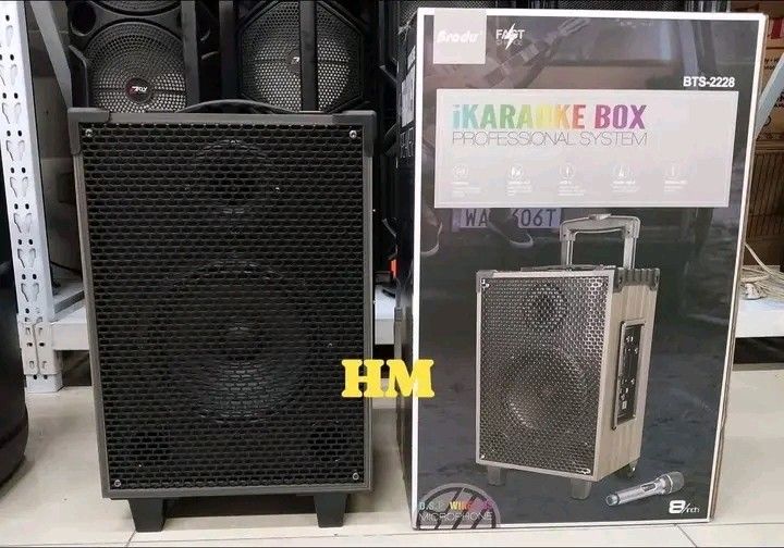 Brodu BTS-2228 8" Karaoke Box Speaker (Category: Soundbars, Speakers & Amplifiers) located in Manila. Submitted by legitseller_angel06 (Listing ID 1426797139, Image 3). Description: Brodu BTS-2228 karaoke box speaker features Bluetooth, USB, TF, and line-in connectivity. It includes a wireless microphone and a USB charging cable. The speaker has an 8-inch size and RGB light. It has a trolley design for easy transport. The unit dimensions are 30x2