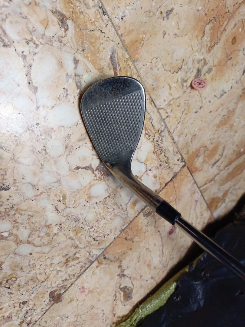 Callaway Forged 52 Wedge (Category: Golf) located in Manila. Submitted by yeonmei5614747 (Listing ID 1426843128, Image 3). Description: Callaway Forged 52 wedge. The club head has visible wear. The club is designed for precision shots around the green. The club face has grooves for spin and control. It is a right-handed club..