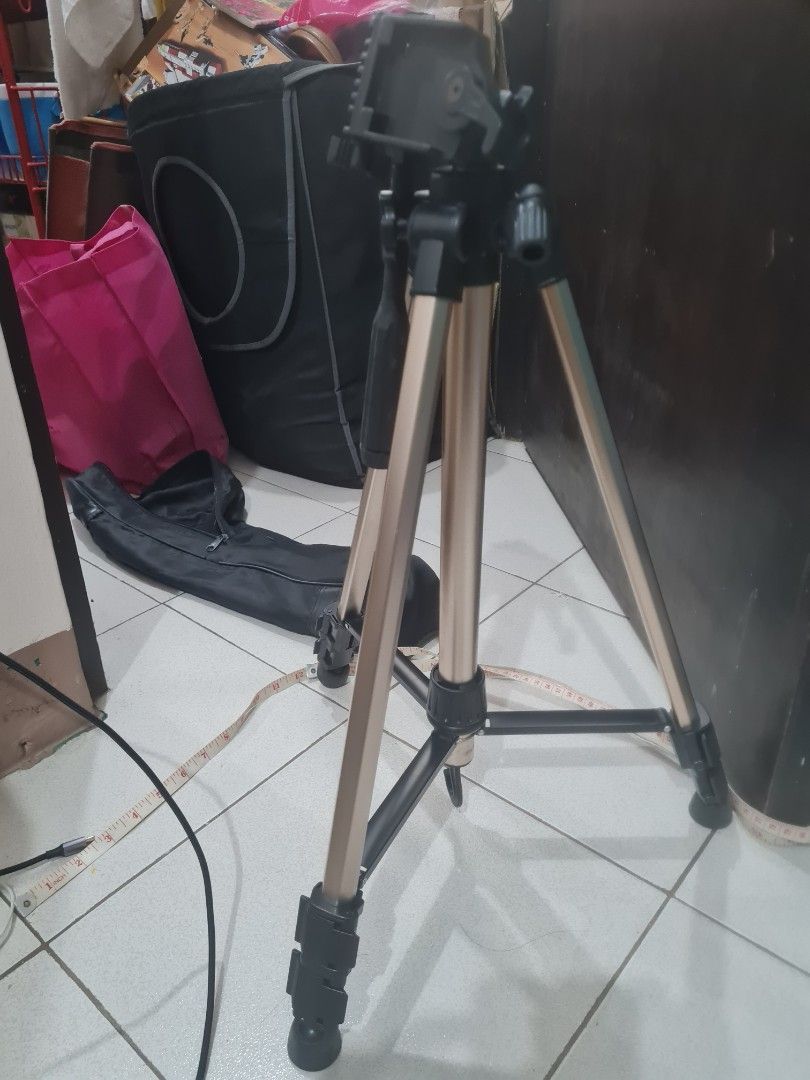 Camera Tripod with Carrying Bag (Category: Tripods & Monopods) located in Quezon City. Submitted by declutter1990 (Listing ID 1426815279, Image 1). Description: Tripod is designed for stability and ease of use. It features adjustable legs and a mounting head for cameras. Includes a carrying bag for convenient transport and storage..