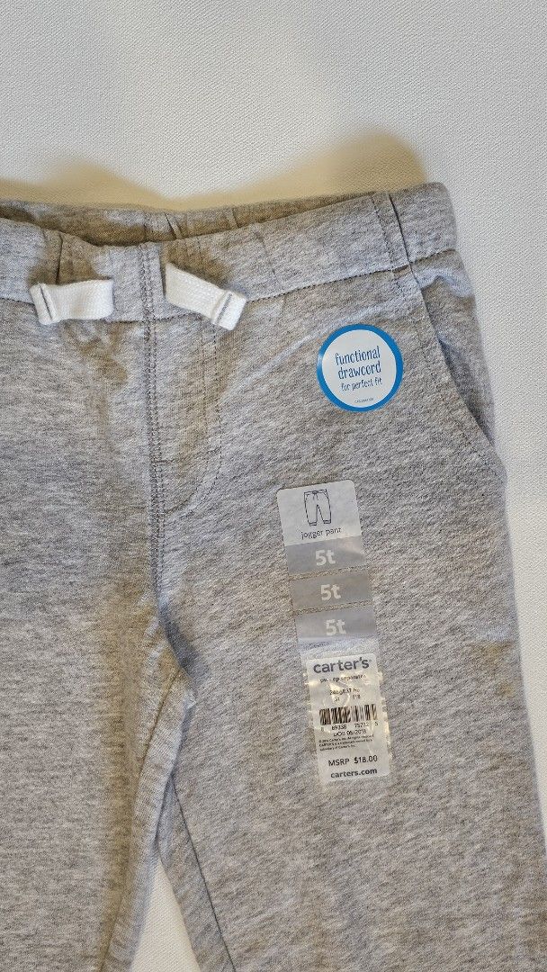 Carter's Toddler Jogger Pants 5T (Category: Babies & Kids Fashion) located in Quezon. Submitted by cgmhe (Listing ID 1426872481, Image 3). Description: Carter's toddler sweatpants in size 5T. Features a drawstring waist and two front pockets. Made of 100% cotton. The pants are gray in color. The tag indicates the item is made in Vietnam..