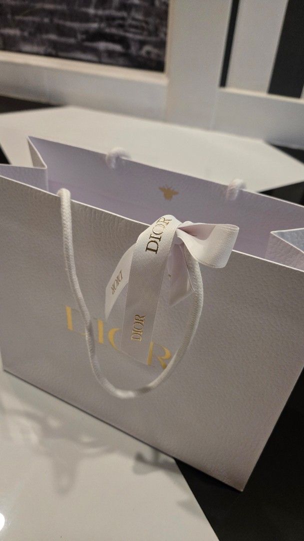 Dior Paper Bag (Category: Luxury Accessories) located in Manila. Submitted by primrepublic (Listing ID 1426796343, Image 1). Description: Authetic Dior Paper Bag with ribbon 27x23cm .