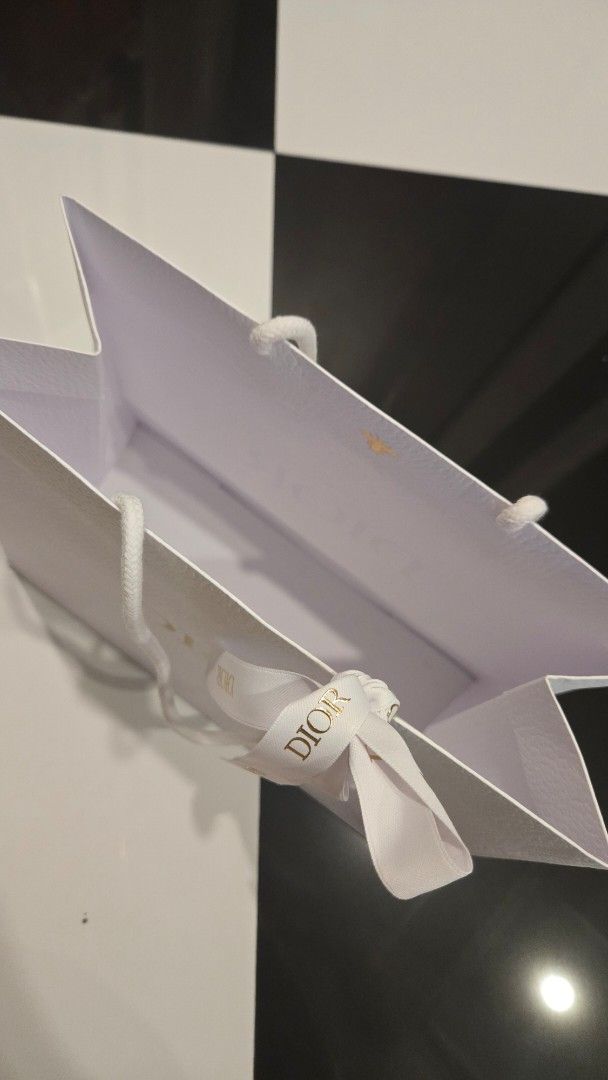 Dior Paper Bag (Category: Luxury Accessories) located in Manila. Submitted by primrepublic (Listing ID 1426796343, Image 3). Description: Authetic Dior Paper Bag with ribbon 27x23cm .