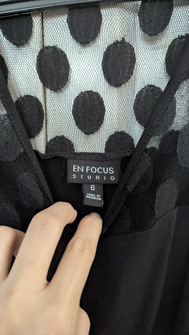 En Focus Studio Black Dress Size 6 (Category: Dresses) located in Muntinlupa City. Submitted by lsfinds (Listing ID 1426834315, Image 2). Description: Elegant black dress from En Focus Studio. Features a unique polka dot mesh neckline and a tiered skirt design. It is a size 6 and made in Indonesia. Perfect for a special occasion or a night out..